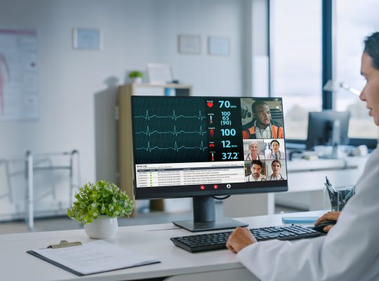 Physician in assist call discussing patient vitals